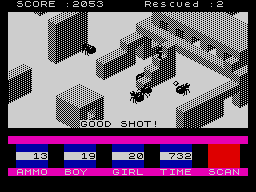 Ant Attack running on a ZX Spectrum: an isometric grey city, two ants closing on a figure, the message GOOD SHOT! across the middle, and a status panel reading AMMO 13, BOY 19, GIRL 20, TIME 732